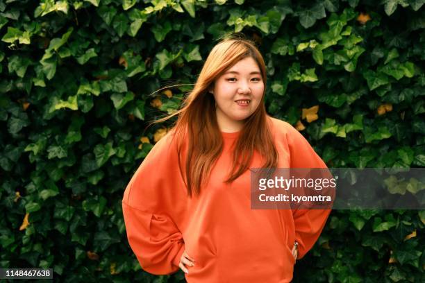 the portrait video of asian woman - fat asian woman stock pictures, royalty-free photos & images
