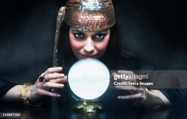gypsy woman with crystal ball - fortune teller fotografías e imágenes de stock