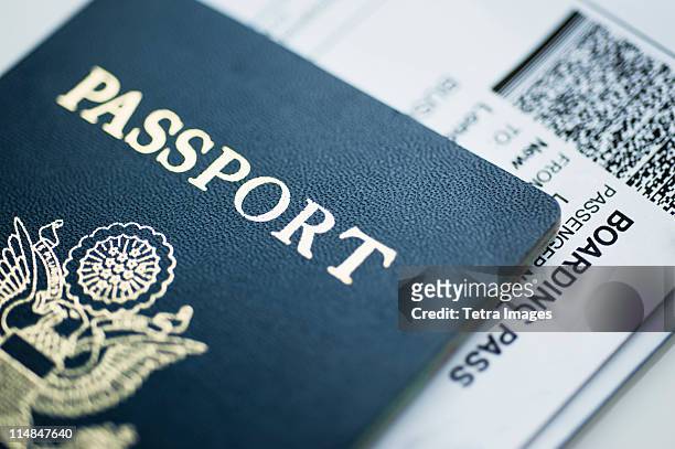 american passport with boarding pass inside - 飛行機の搭乗券 ストックフォトと画像