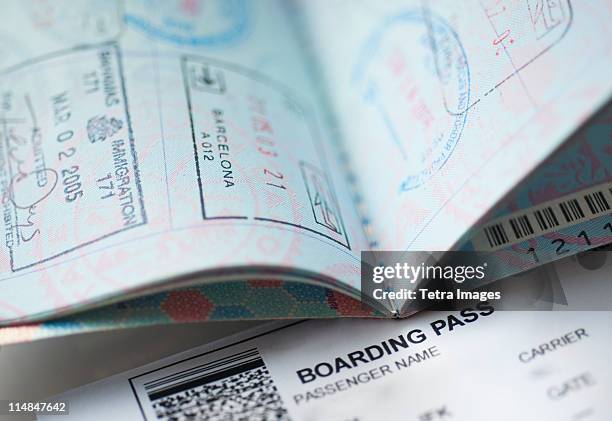 passport with boarding pass inside - pass stamp stock pictures, royalty-free photos & images
