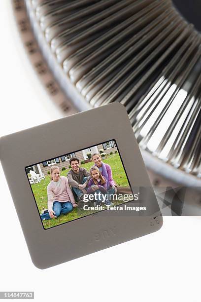 close up of slides and on round slide tray - slide projector stock pictures, royalty-free photos & images
