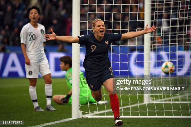 France's forward Eugenie Le Sommer celebrates after scoring a goal during the France 2019 Women's World Cup Group A football match between France and...