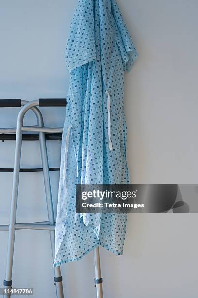 walking frame and patients gown in hospital - examination gown stock pictures, royalty-free photos & images