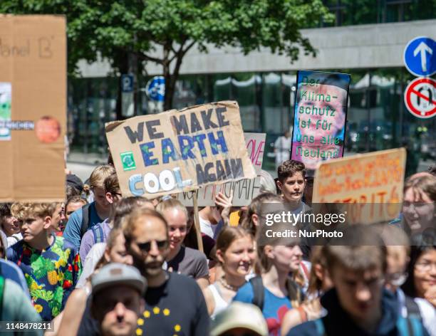Sign with Angela Merkel. Several hundreds students protested on 7 June 2019 in Munich, Germany against the climate and environment policy of the...