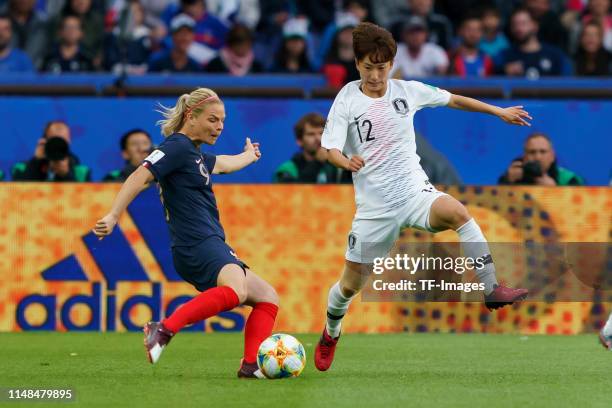 Eugenie Le Sommer of France and Yu-Mi Kang of Korea battle for the ball during the 2019 FIFA Women's World Cup France group A match between France...