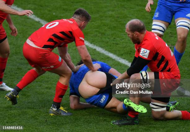 James Lowe of Leinster has his shorts pulled down in a tackle from Schalk Burger of Saracens during the Champions Cup Final match between Saracens...