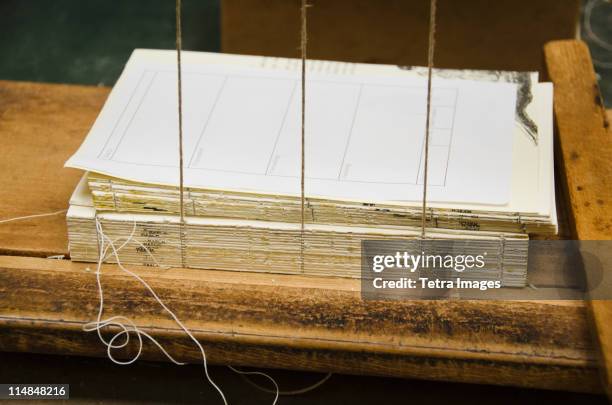 united kingdom, bristol, book binding workshop - reliure de livre photos et images de collection