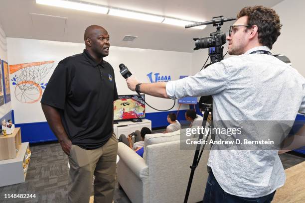 Adonal Foyle talks to the media during the NBA Cares Finals Legacy Project on June 6, 2019 at Ira Jinkins Recreation Center in Oakland, California....