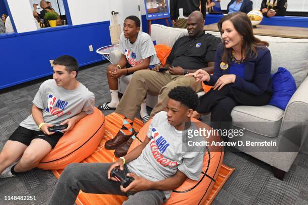 Mayor of Oakland, Libby Schaaf and Adonal Foyle watch TV during the NBA Cares Finals Legacy Project on June 6, 2019 at Ira Jinkins Recreation Center...