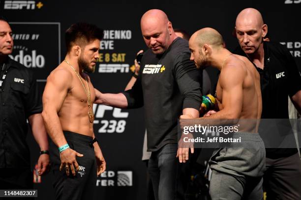 Henry Cejudo and Marlon Moraes of Brazil face off during the UFC 238 weigh-in at the United Center on June 7, 2019 in Chicago, Illinois.