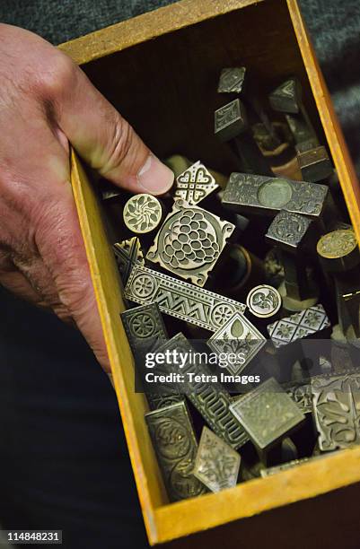 united kingdom, bristol, close up of printing blocks from antique printing press - book binding stock pictures, royalty-free photos & images