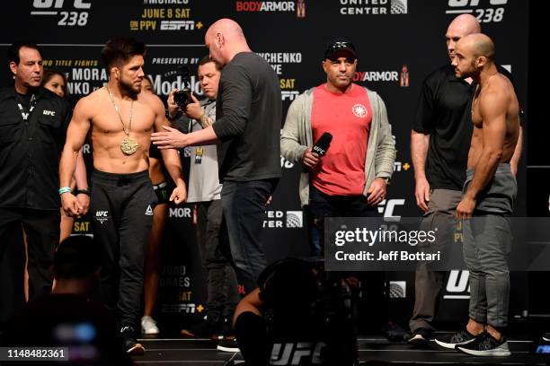 Henry Cejudo and Marlon Moraes of Brazil face off during the UFC 238 weigh-in at the United Center on June 7, 2019 in Chicago, Illinois.