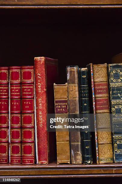 united kingdom, bristol, close up of antique books on shelf - book binding stock pictures, royalty-free photos & images