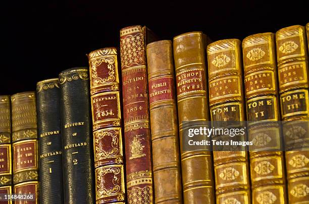 united kingdom, bristol, close up of antique books on shelves - book binding stock pictures, royalty-free photos & images