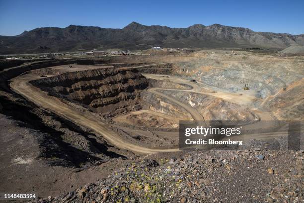 Mining equipment sits inside the pit at the Mountain Pass mine, operated by MP Materials, in Mountain Pass, California, U.S., on Friday, June 7,...