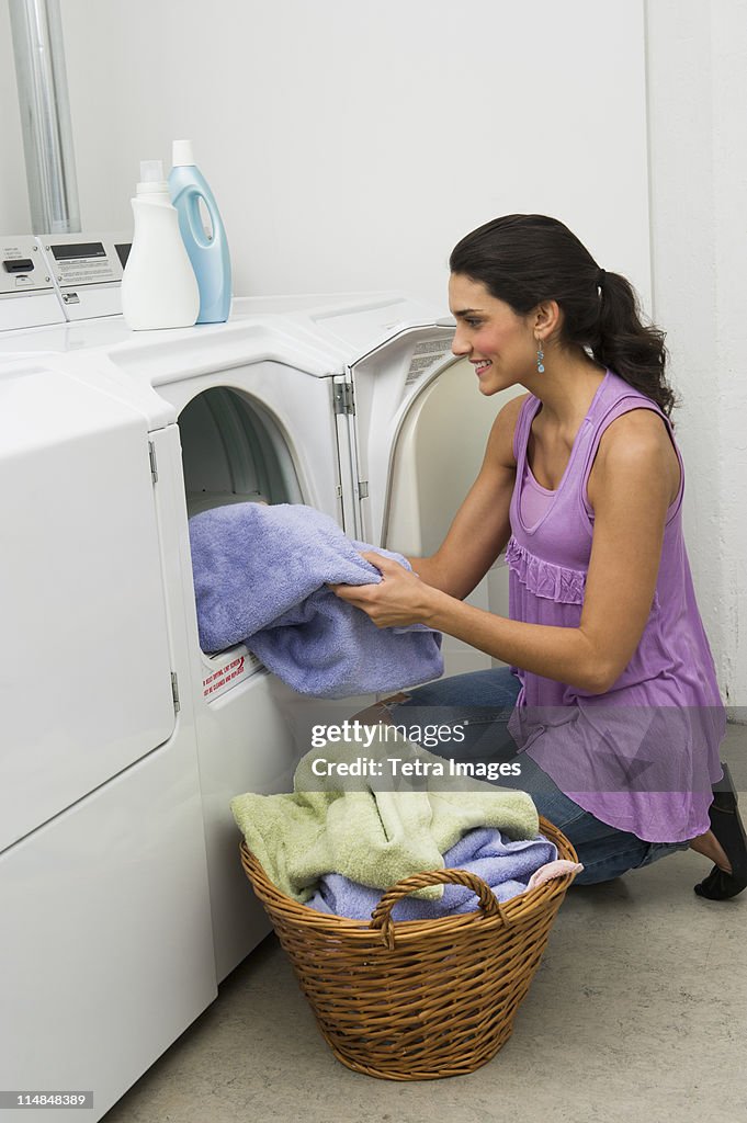USA, New Jersey, Jersey City, woman doing laundry