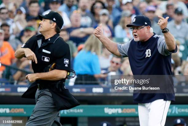 Manager Ron Gardenhire of the Detroit Tigers is tossed by home plate umpire James Hoye, left, while argue a balk called against Tigers pitcher...