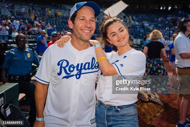 Selena Gomez and Paul Rudd pose for a photo before playing in a celebrity softball game at Kauffman Stadium during the Big Slick Celebrity Weekend...