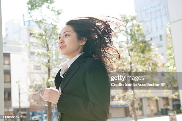 businesswoman running, tokyo prefecture, honshu, japan - running woman ストックフォトと画像