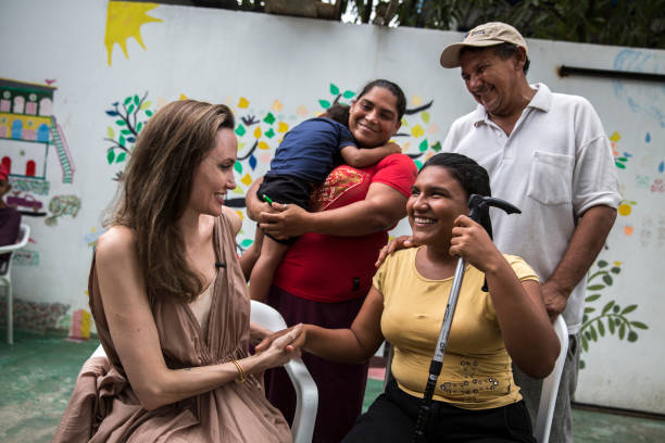 In this handout image provided by United Nations High Commission for Refugees, UNHCR Special Envoy Angelina Jolie meets with Ester Barboza in...