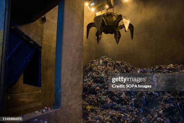 Metal claw grabs non recyclable waste before transporting it to the incinerator at a Thermal Waste Recycling Facility in Gdansk. The first Polish...