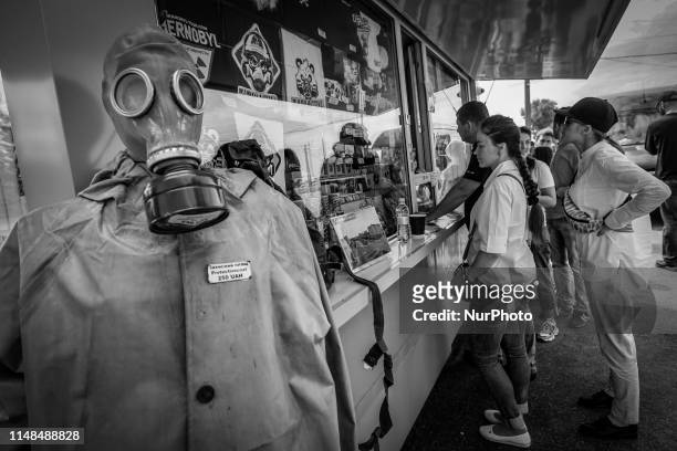 Image was converted to black and white) Visitors get tourist information at the Dityatki checkpoint at the entrance to the Chernobyl exclusion zone,...