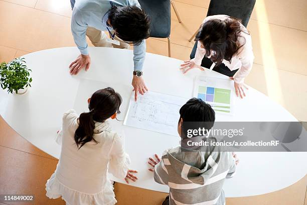 businesspeople in a meeting, tokyo prefecture, honshu, japan - rf business stock pictures, royalty-free photos & images