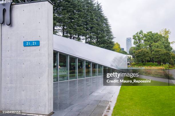 view of the 21_21 design sight museum designed by japanese architect tadao ando in roppongi district at minato ward, tokyo city, japan - 21_21 design sight design museum stock pictures, royalty-free photos & images