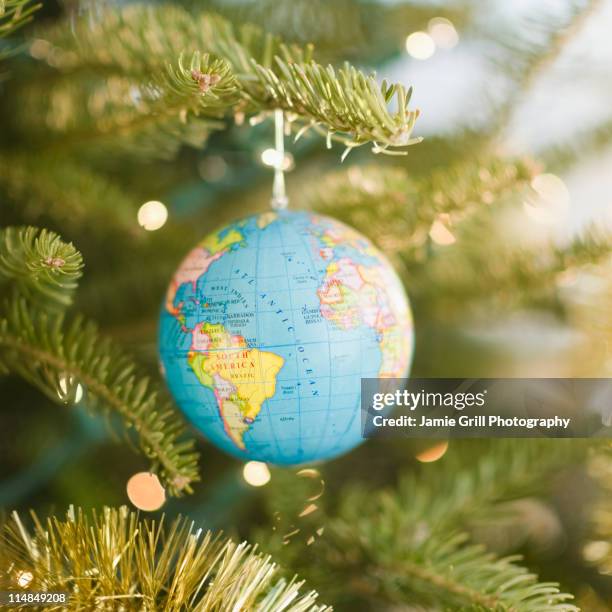 usa, new jersey, jersey city, globe bauble on christmas tree - villaggio globale foto e immagini stock