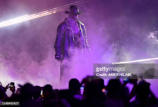 World Wrestling Entertainment star The Undertaker makes his way to the ring during a match at the World Wrestling Entertainment Super Showdown event...