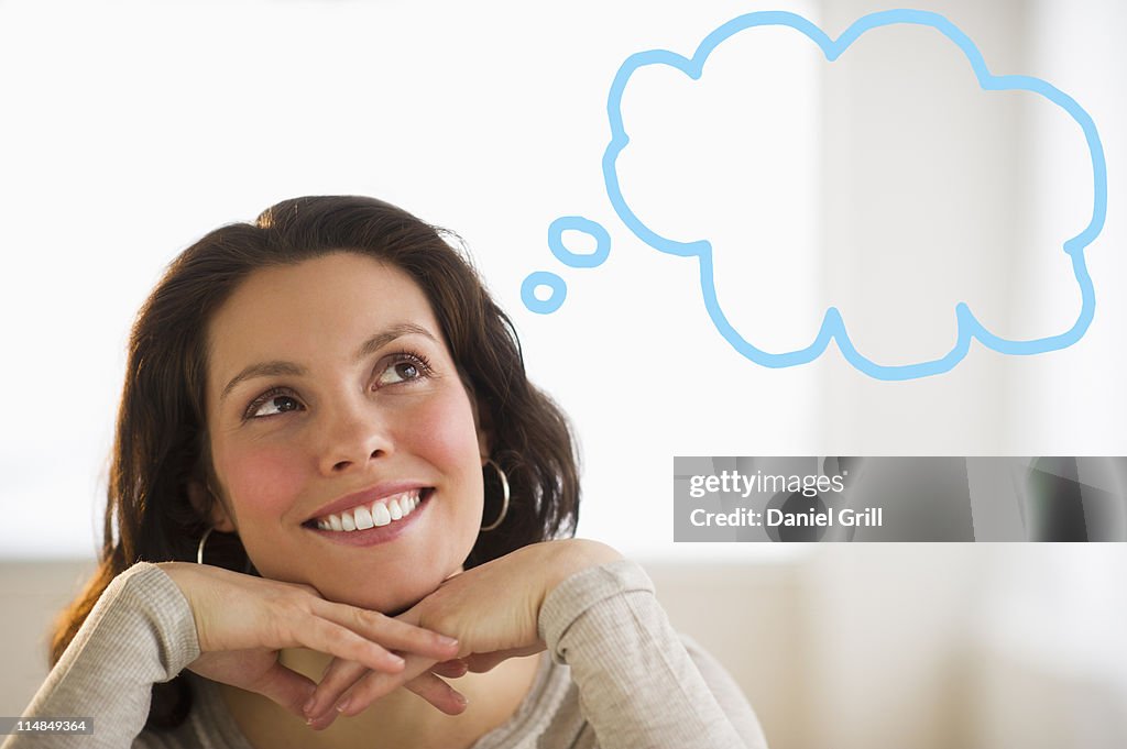 USA, New Jersey, Jersey City, Happy young woman daydreaming