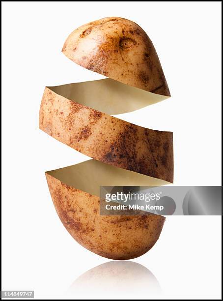 potato peel in potato shape, studio shot - rind stock pictures, royalty-free photos & images