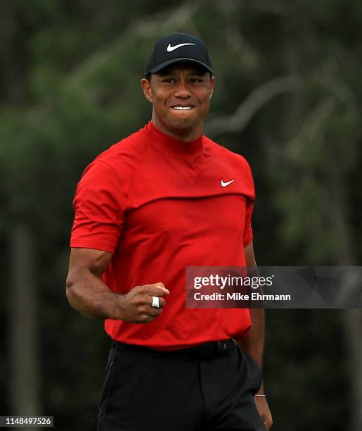 Tiger Woods of the United States celebrates winning the Masters during the final roubnd at Augusta National Golf Club on April 14, 2019 in Augusta,...