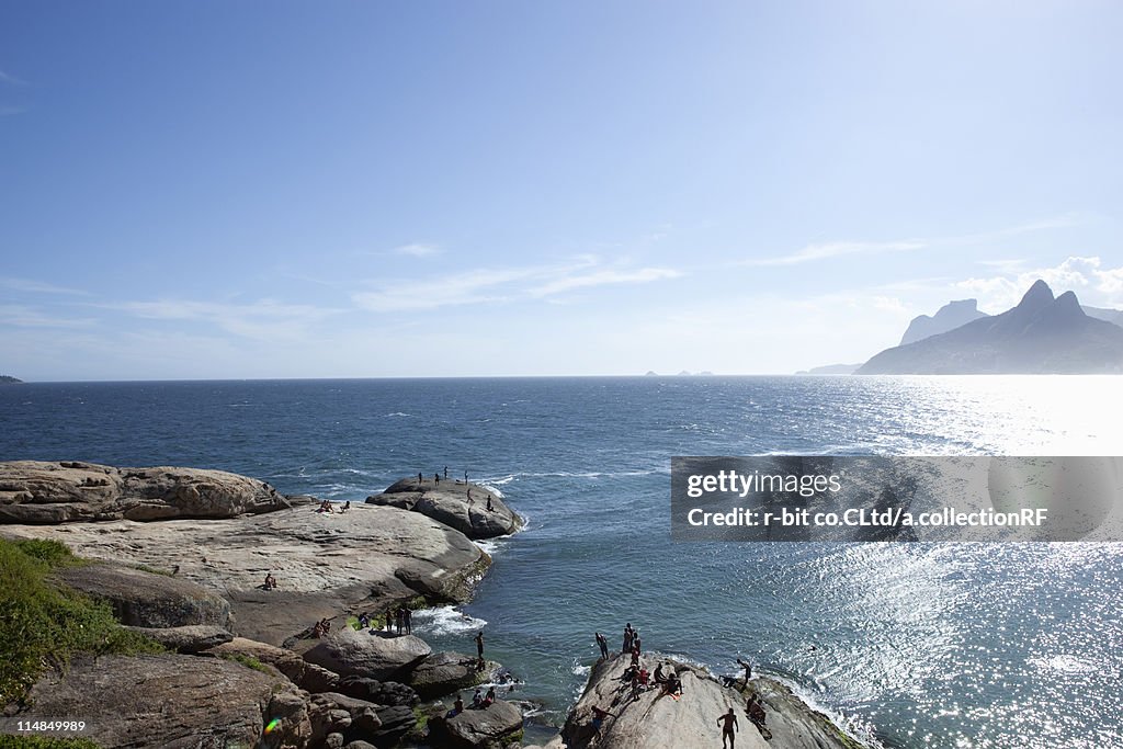 People Relaxing on Rocks