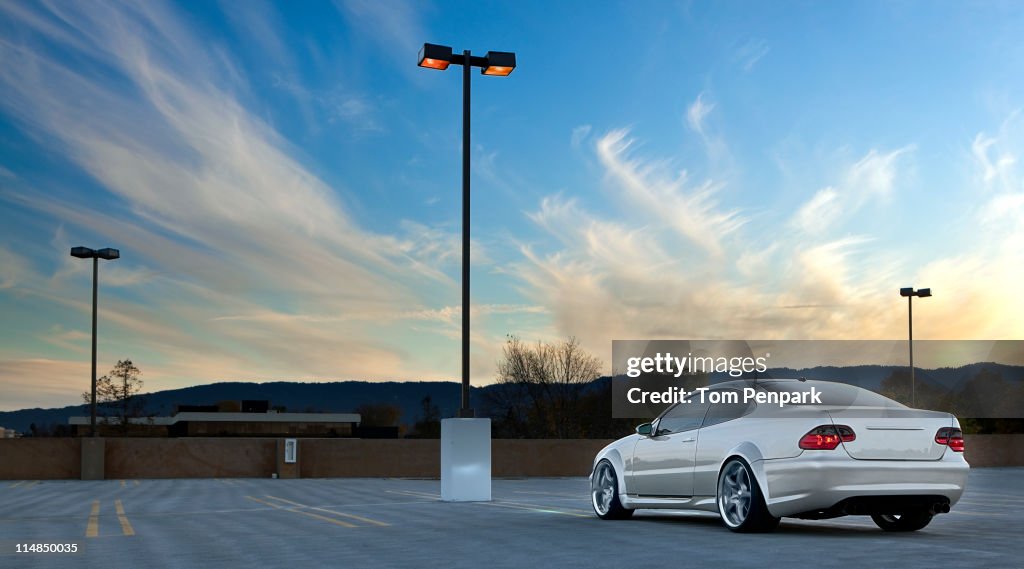 Car parked in empty parking lot