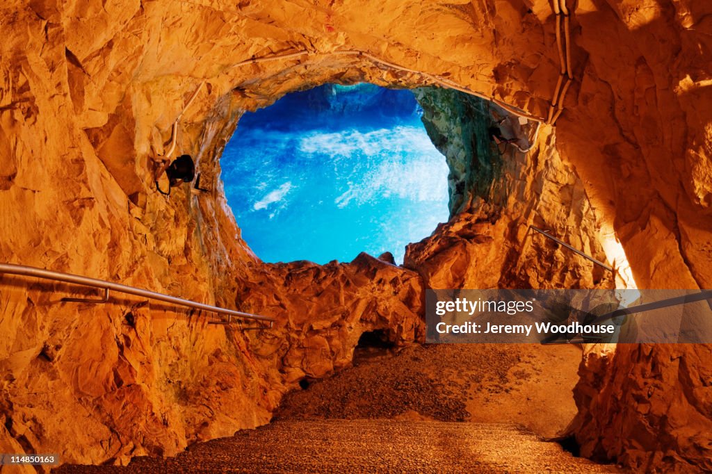 Blue sky through opening in cave