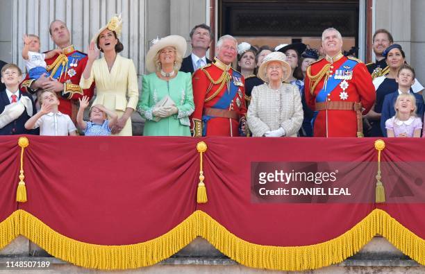 Britain's Prince William, Duke of Cambridge holding Prince Louis, Prince George, Princess Charlotte, Britain's Catherine, Duchess of Cambridge,...