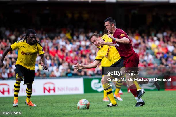 Luis Garcia of Liverpool FC battles for the ball with Jorg Heinrich of Borussia Dortmund during the match between Liverpool FC Legend and Borussia...