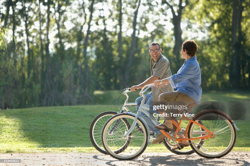 Hispanic couple riding bicycles