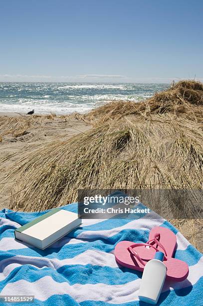 usa, massachusetts, towel on marram grass on beach - towel lined stock pictures, royalty-free photos & images