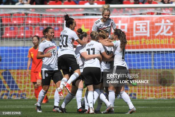 Germany's defender Giulia Gwinn celebrates with teammates after scoring a goal during the France 2019 Women's World Cup Group B football match...