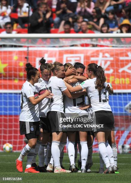 Germany's defender Giulia Gwinn celebrates with teammates after socring a goal during the France 2019 Women's World Cup Group B football match...