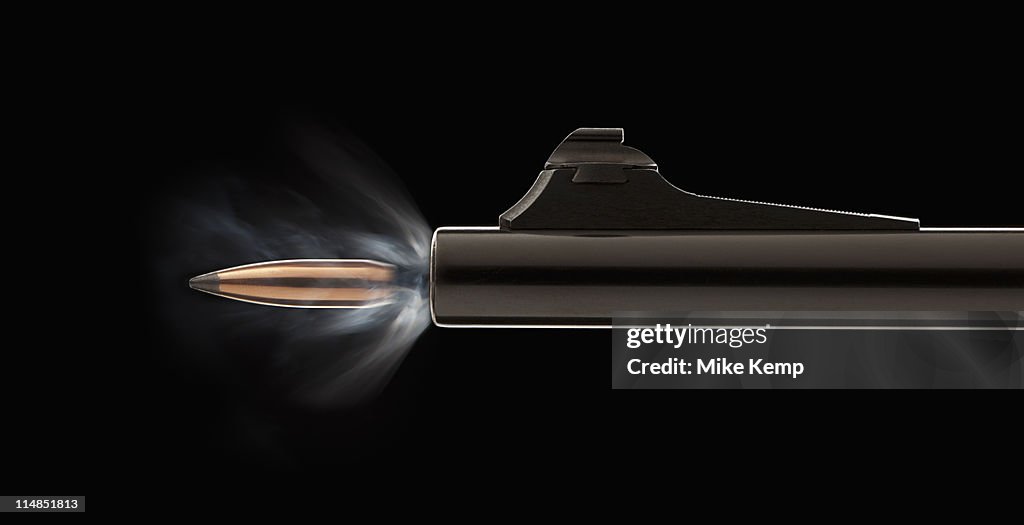 Bullets Getting Shot Studio Shot Of Bullet Coming Out Of Gun Barrel Photo - Getty Images