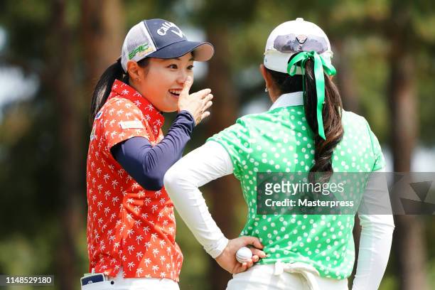 Momoka Miura and Yui Kawamoto of Japan share a laugh on the 7th green during the final round of the World Ladies Championship Salonpas Cup at Ibaraki...