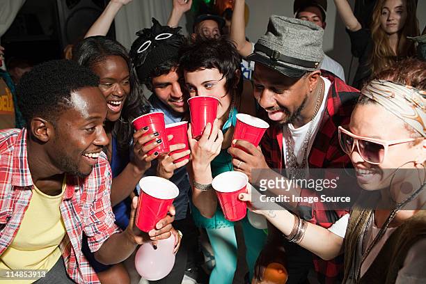 young people with plastic cups at party - plastic cup stock pictures, royalty-free photos & images