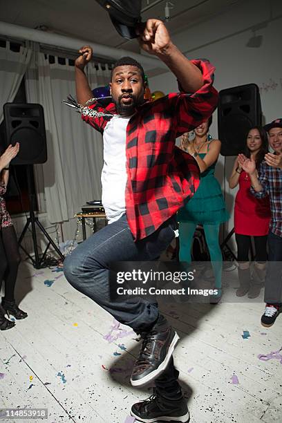 man wearing checked shirt dancing at party - checked shirt stock pictures, royalty-free photos & images