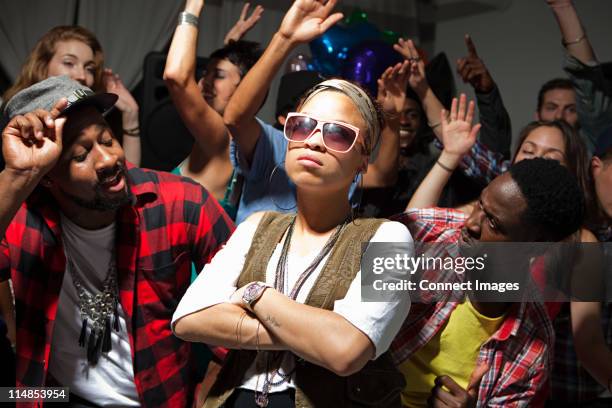 woman wearing sunglasses at party - sad person at party stock pictures, royalty-free photos & images