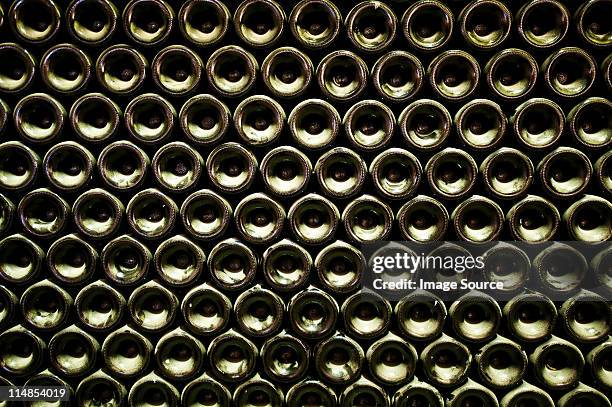 stack of wine bottles, full frame - wine rack stock pictures, royalty-free photos & images