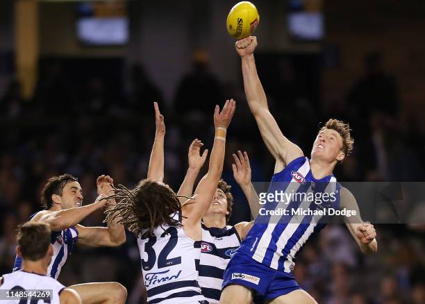 Nick Larkey of the Kangaroos punches the ball during the round eight AFL match between the North Melbourne Kangaroos and the Geelong Cats at Marvel...