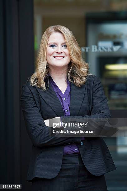 bank teller outside bank, portrait - teller stock pictures, royalty-free photos & images